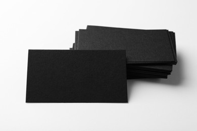 Blank black business cards on white background. Mockup for design