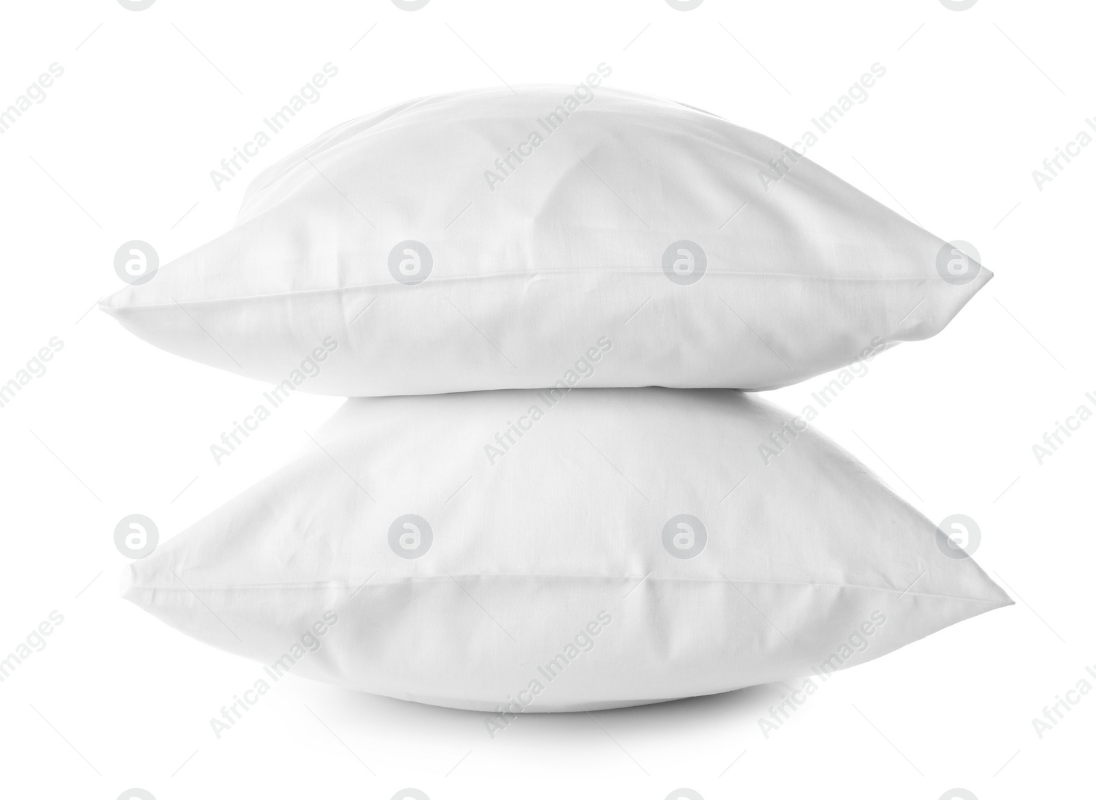 Photo of Soft orthopedic pillows on white background