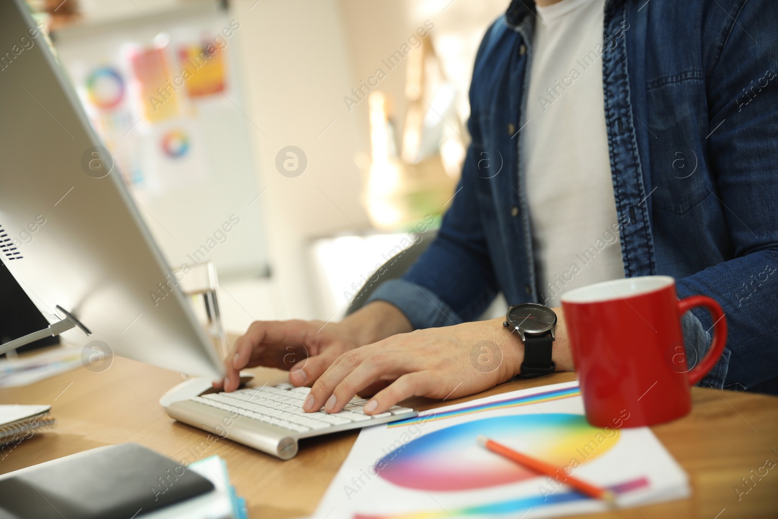 Photo of Professional designer working with computer in office, closeup