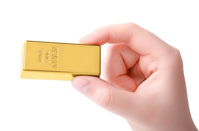 Woman holding shiny gold bar on white background, closeup