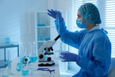 Photo of Scientist working with sample in laboratory. Medical research