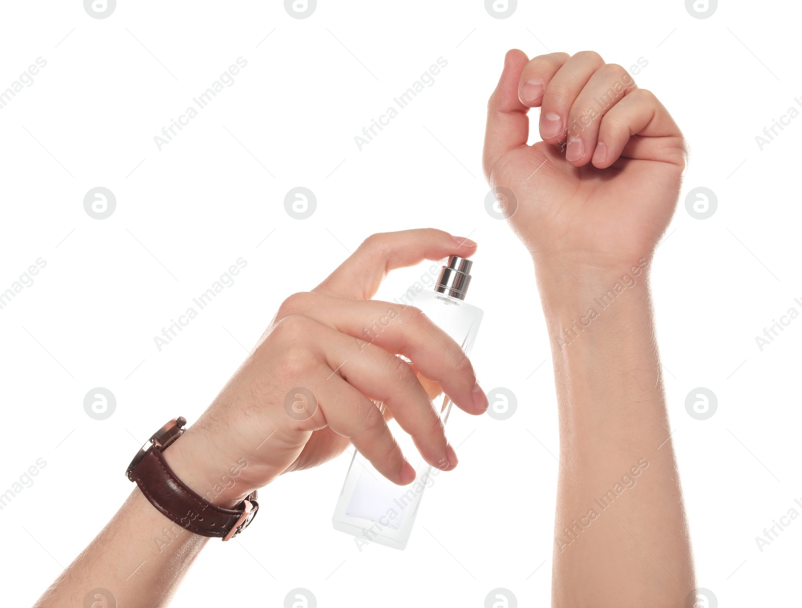 Photo of Man applying perfume on wrist against white background, closeup