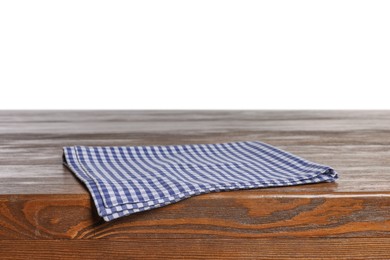 Photo of Checkered tablecloth on wooden table against white background