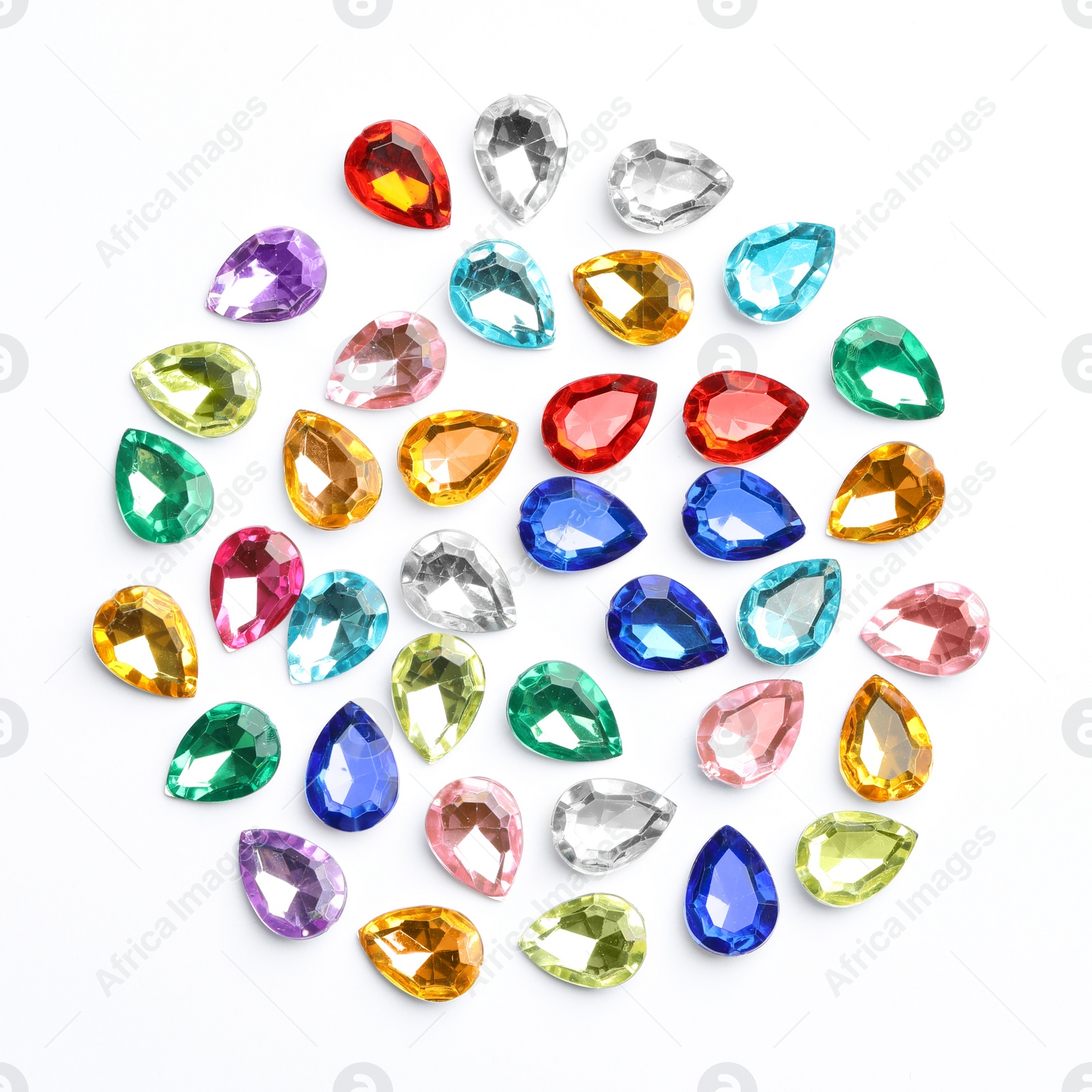 Image of Different beautiful gemstones on white background, top view