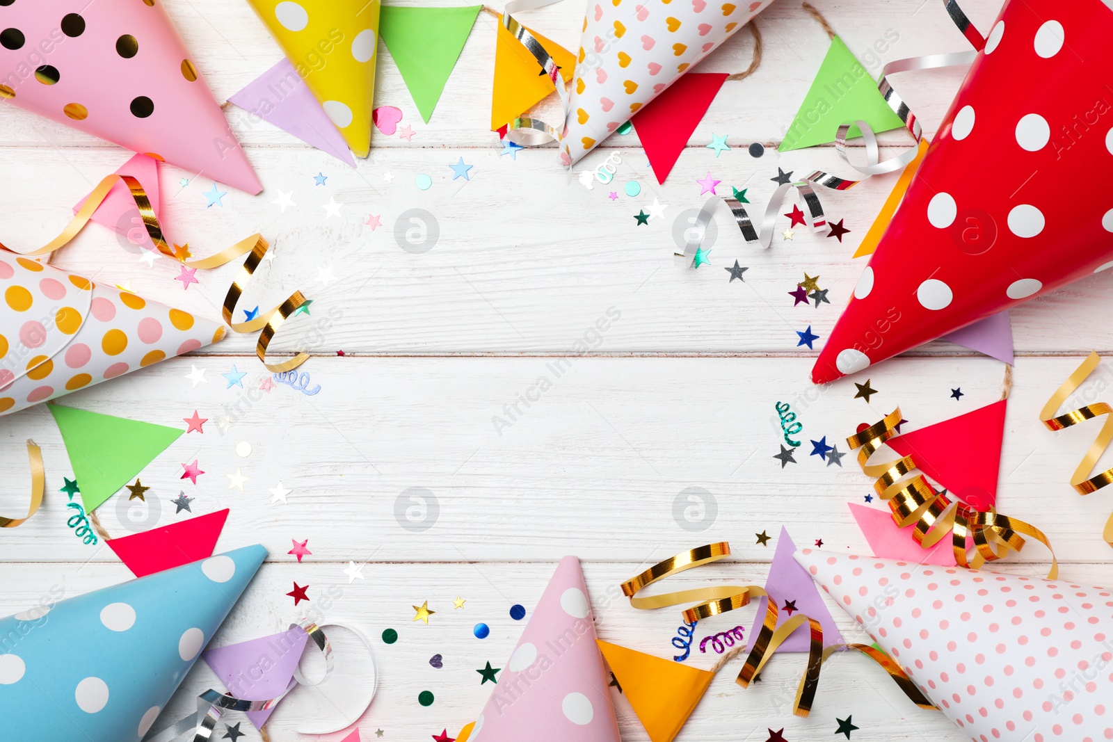 Photo of Flat lay composition with birthday party items on wooden background