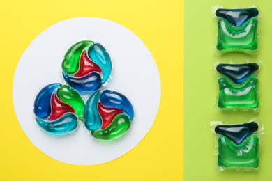 Laundry capsules on color background, flat lay