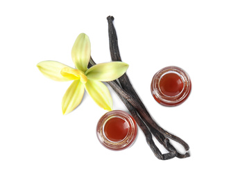 Photo of Vanilla extract, flower and dry pods isolated on white, top view