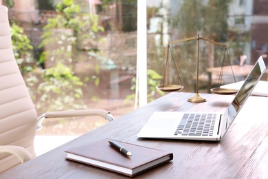 Lawyer's workplace with laptop in office