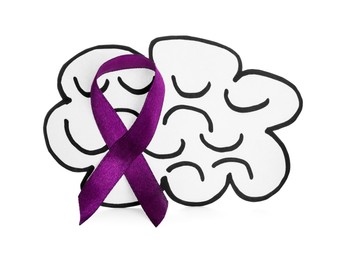 Photo of Paper brain cutout with purple ribbon on white background