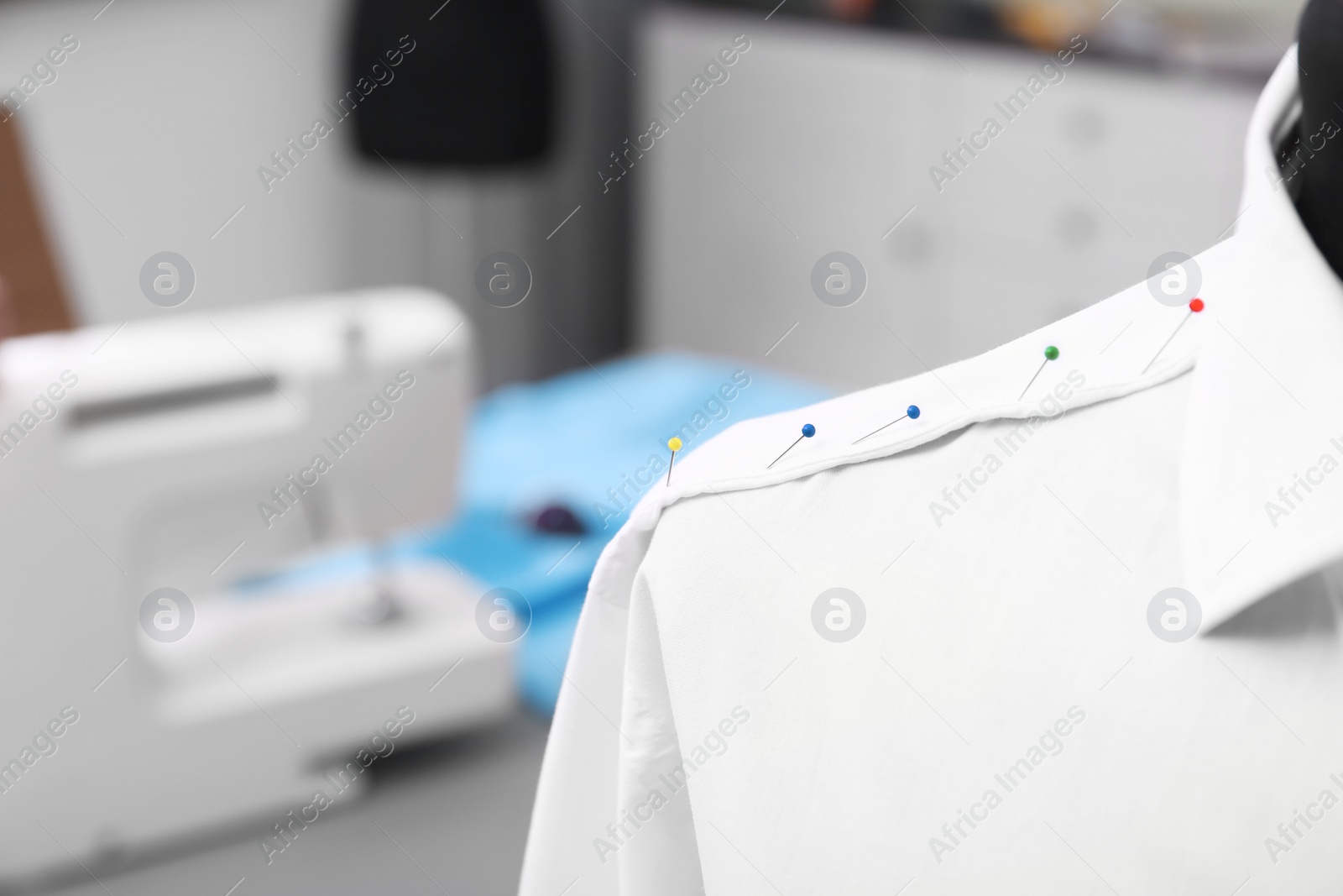 Photo of Mannequin with semi-ready shirt in tailor workshop