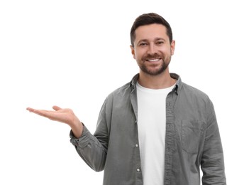 Special promotion. Smiling man holding something on white background