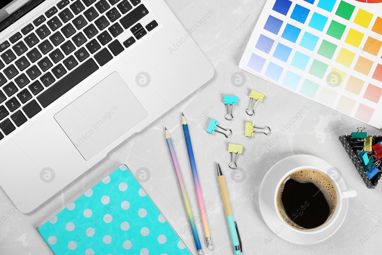 Photo of Flat lay composition with laptop on marble table. Designer workplace