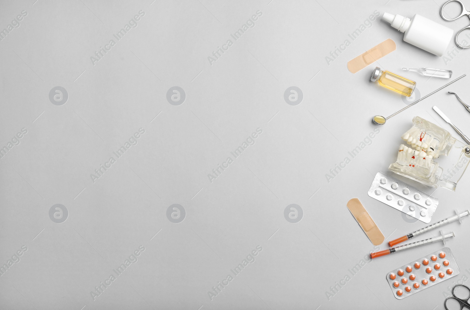 Photo of Flat lay composition with medical items and space for text on color background