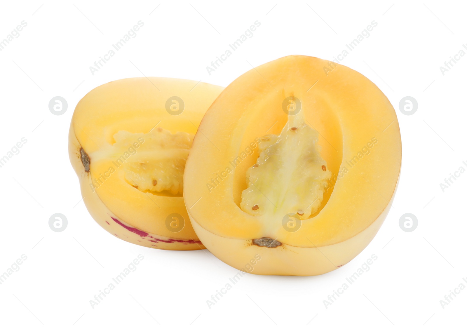 Photo of Halves of fresh ripe pepino melon on white background