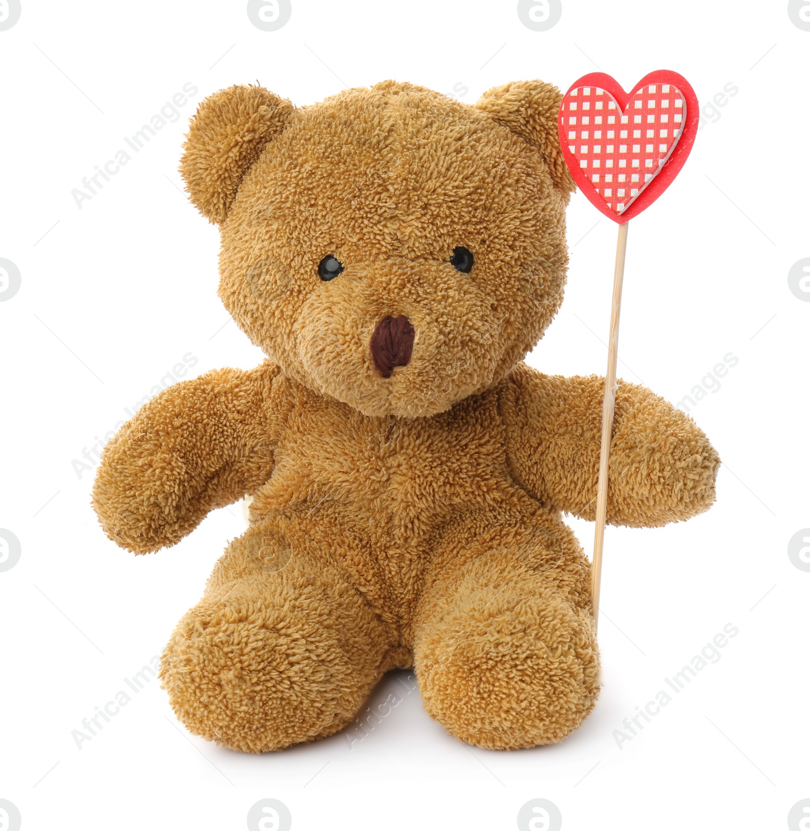 Photo of Cute teddy bear with red heart on white background. Valentine's day celebration