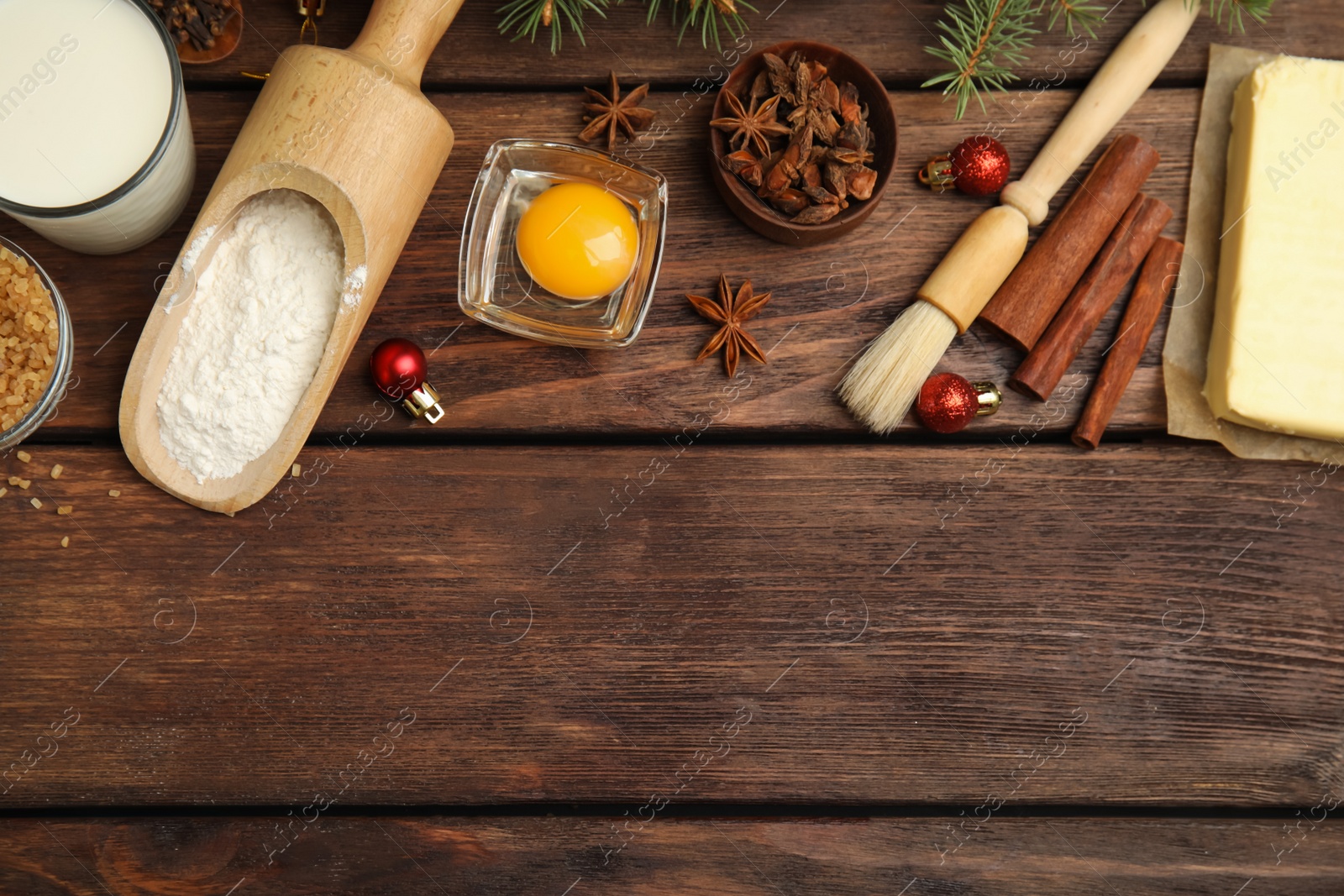 Flat lay composition with ingredients for traditional Christmas cake on wooden table. Space for text Photo of Flat lay composition with ingredients for traditional Christmas cake on wooden table. Space for text
