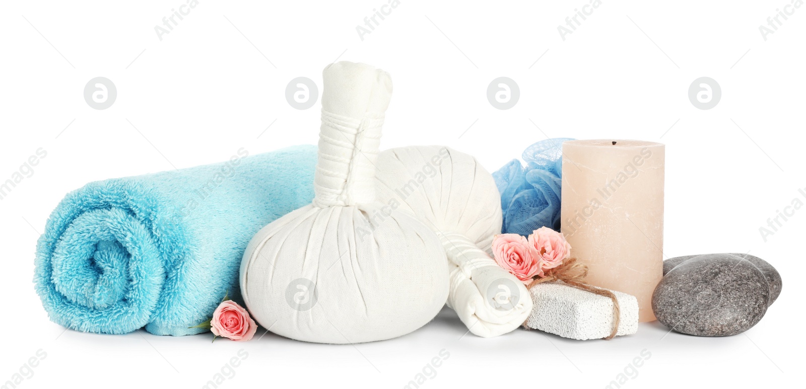 Photo of Herbal massage bags and other spa products on white background