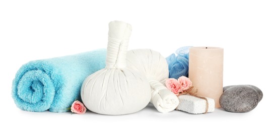 Photo of Herbal massage bags and other spa products on white background