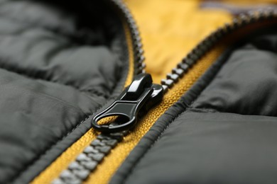 Photo of Closeup view of jacket with zipper as background