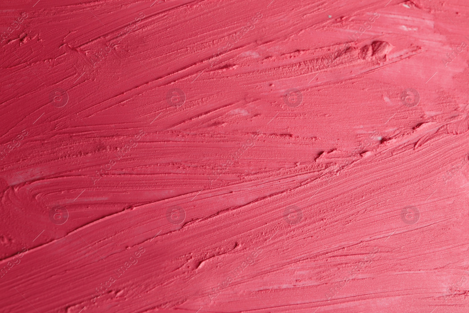 Photo of Strokes of lipstick as background, top view