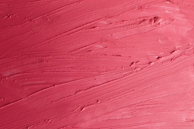 Photo of Strokes of lipstick as background, top view