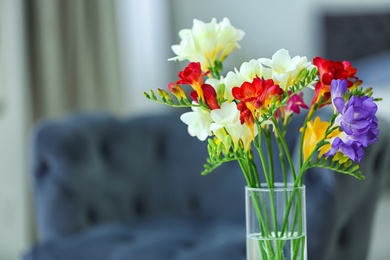 Beautiful bouquet with freesia flowers indoors