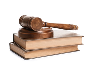 Photo of Wooden gavel and books on white background. Law concept