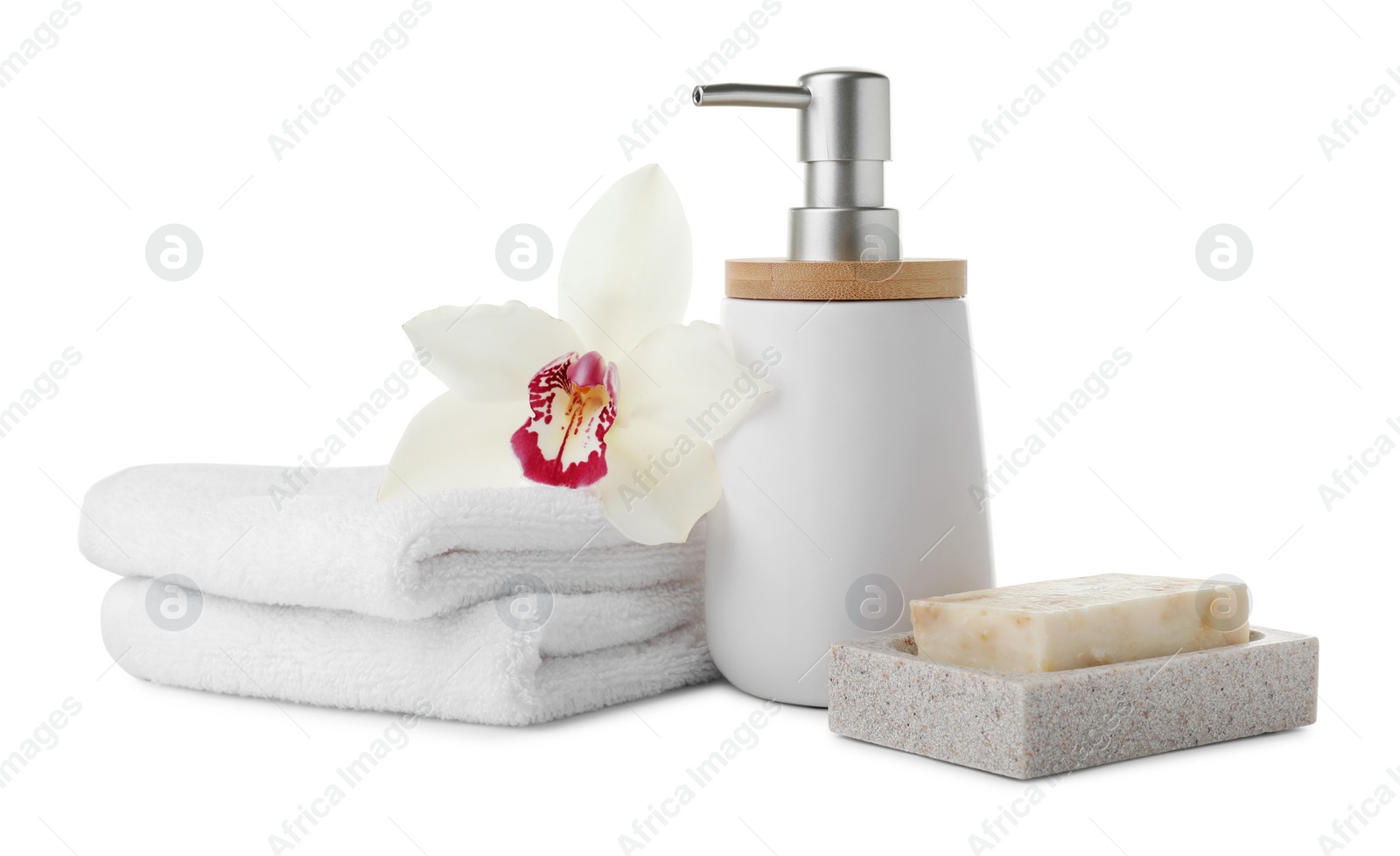 Photo of Dish with soap bar, dispenser and terry towels on white background