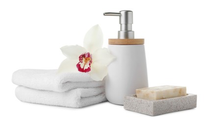 Photo of Dish with soap bar, dispenser and terry towels on white background