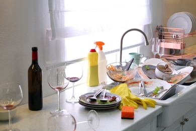 Photo of Dirty dishes in kitchen after new year party