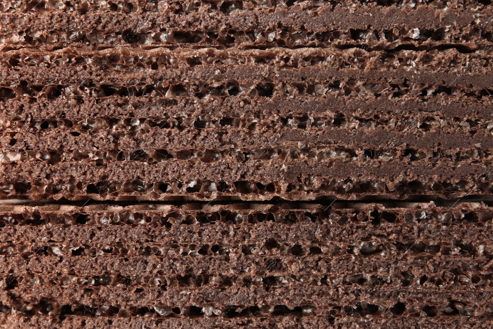 Photo of Closeup view of tasty wafer sticks as background. Sweet food