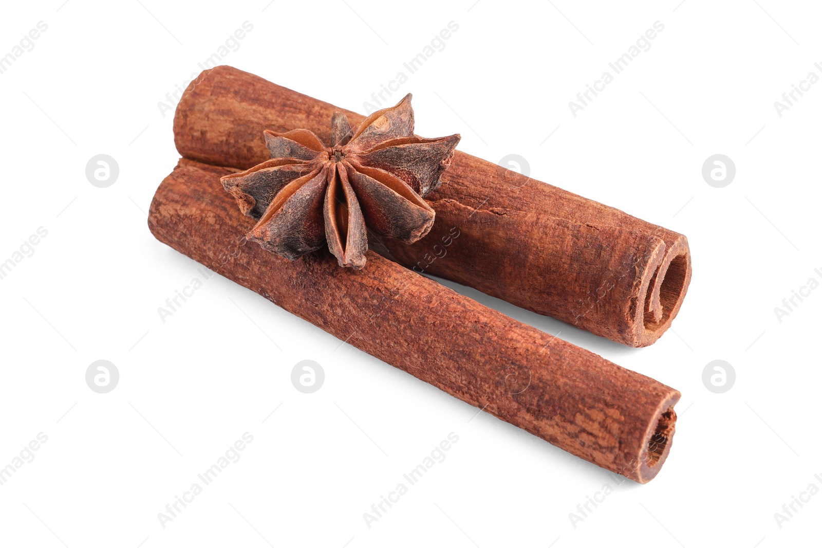 Photo of Cinnamon sticks and anise star isolated on white