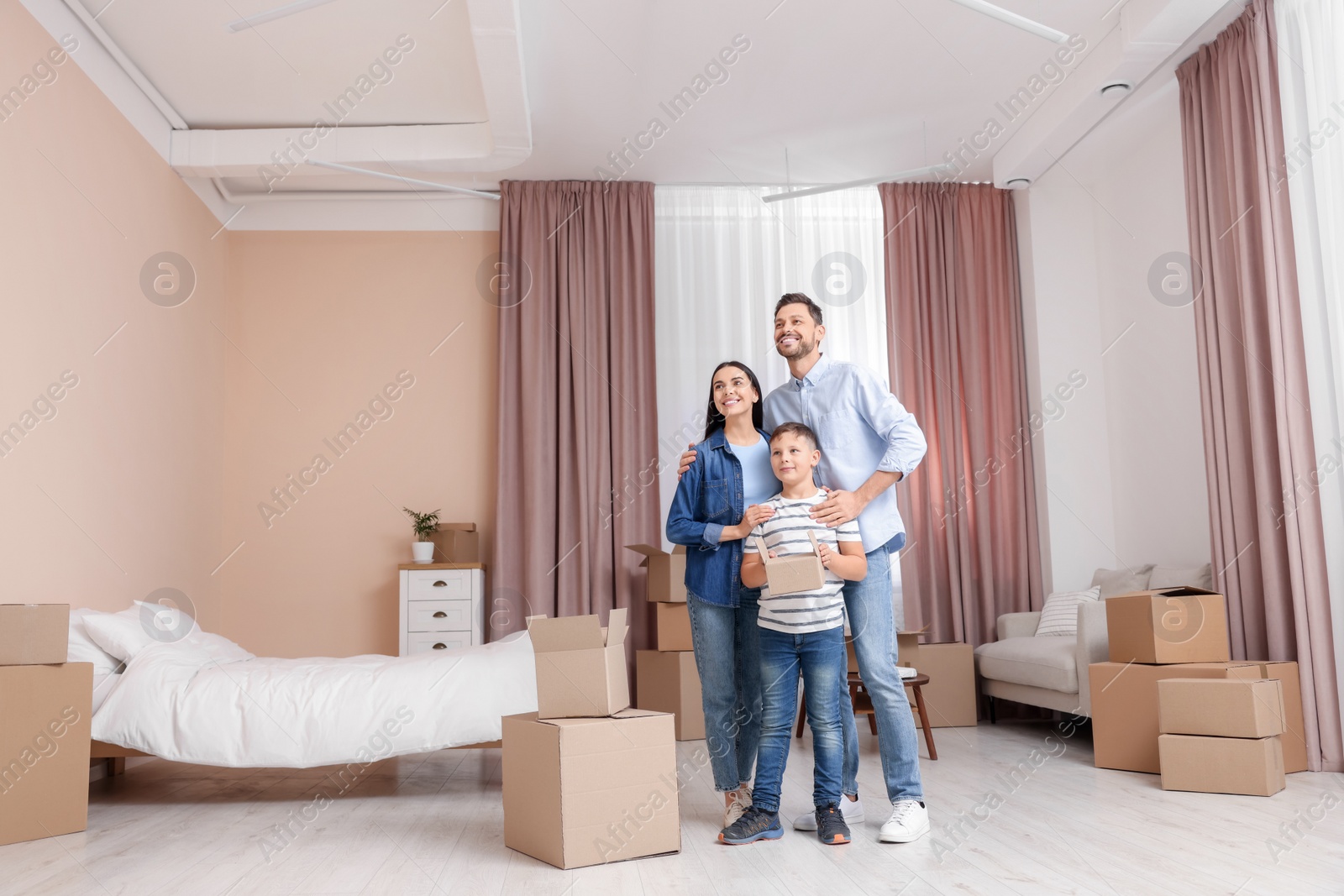 Photo of Happy family spending time in new apartment. Moving day