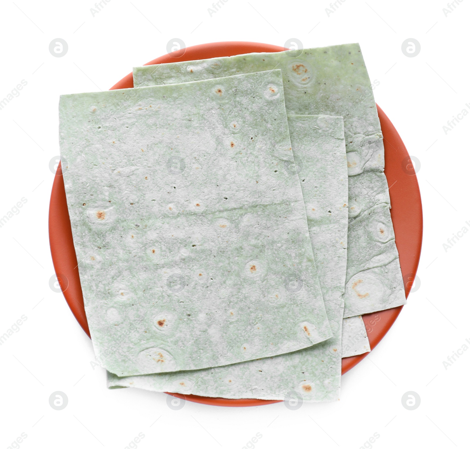 Photo of Plate with delicious green Armenian lavash on white background, top view