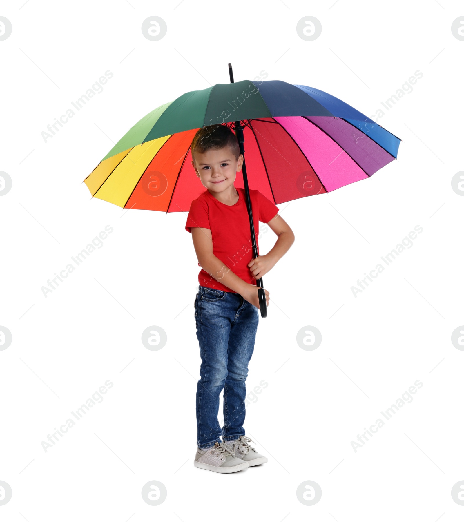 Photo of Little boy with rainbow umbrella on white background