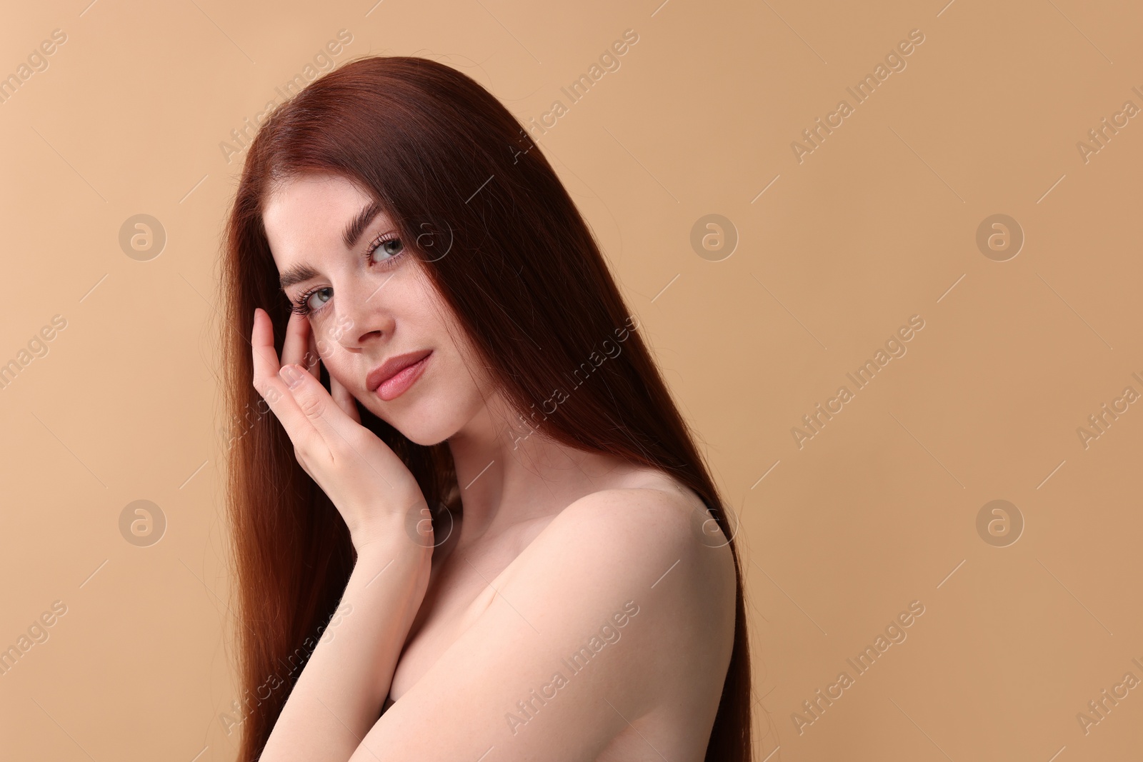 Photo of Portrait of beautiful woman on beige background. Space for text