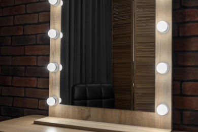 Photo of Mirror with light bulbs in makeup room