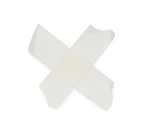 Crossed pieces of masking adhesive tape on white background, top view