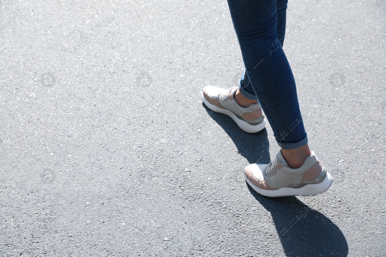 Photo of Woman walking outdoors, closeup with space for text. Choosing way concept.