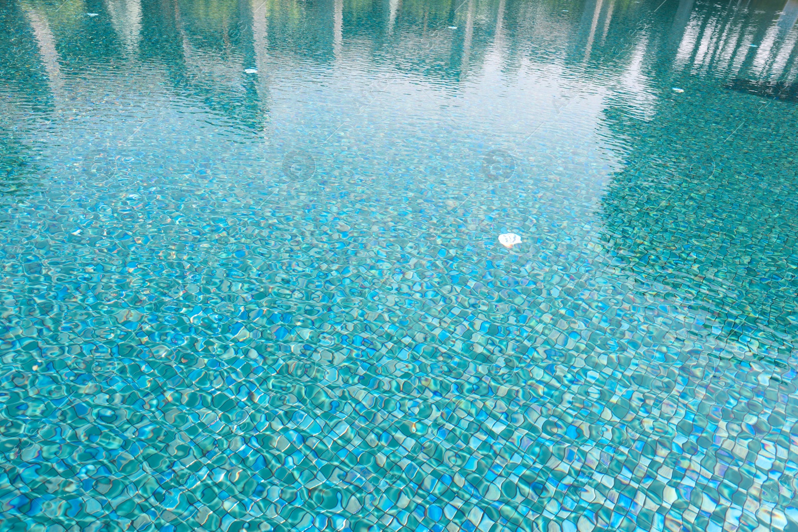 Photo of Clear water with ripples in swimming pool outdoors