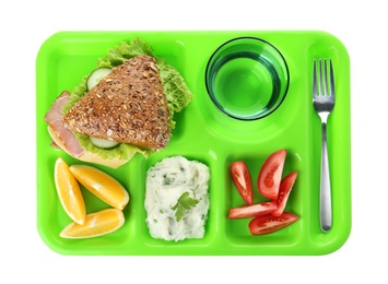 Serving tray with healthy food on white background, top view. School lunch