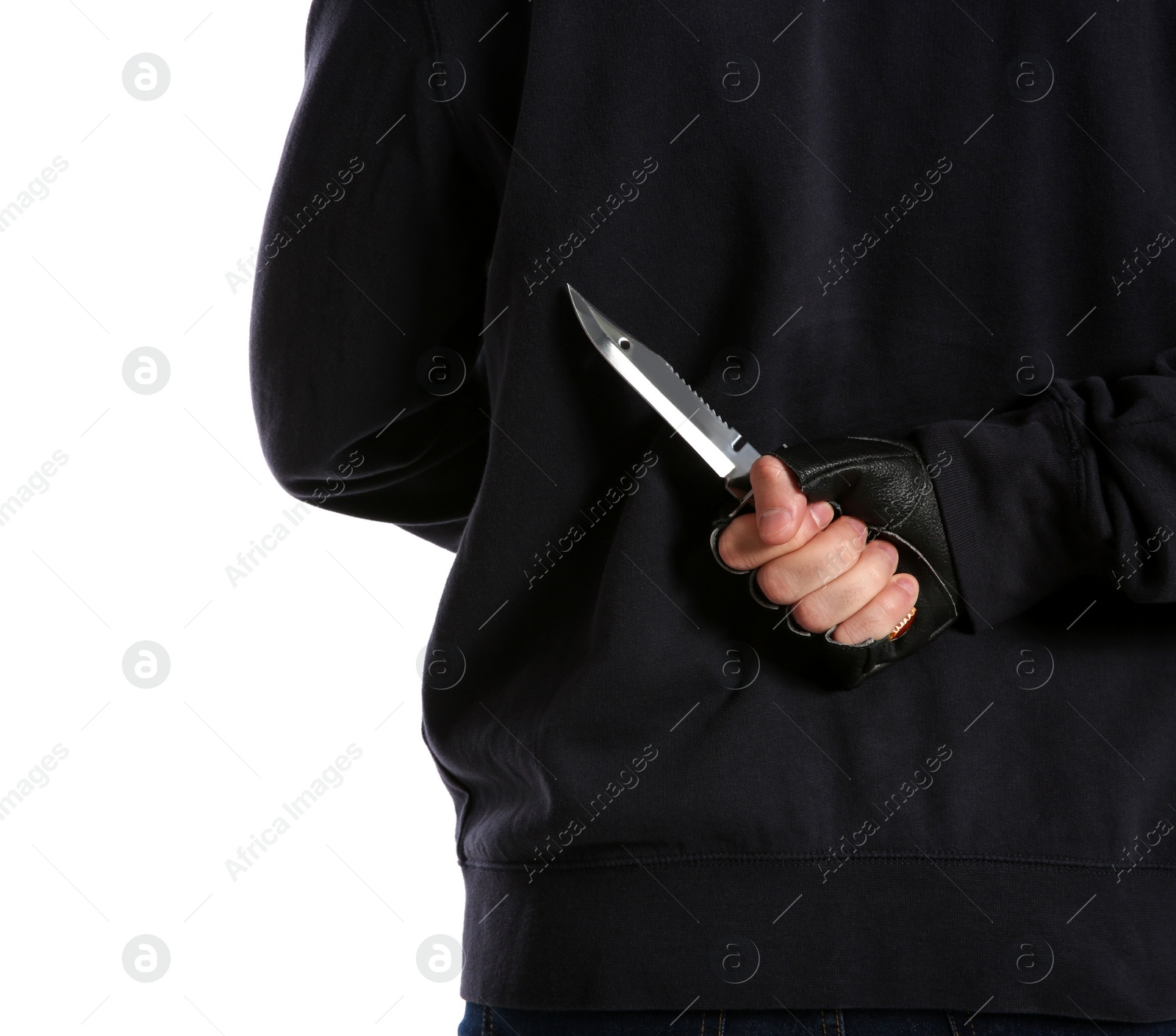 Photo of Man with knife behind his back on white background, closeup. Dangerous criminal