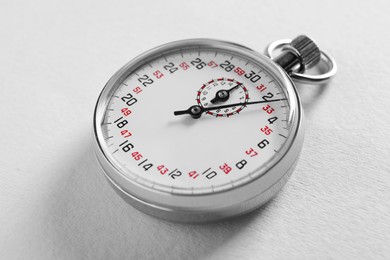 Photo of Vintage timer on light grey background. Measuring tool