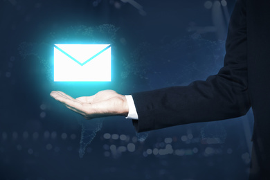 Image of Electronic mail. Businessman demonstrating virtual image of envelope, closeup
