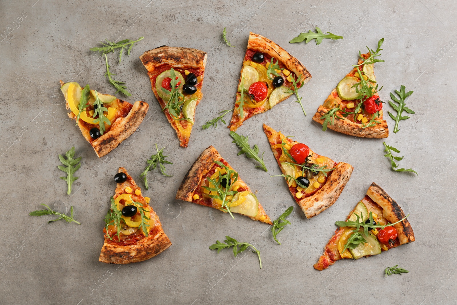 Photo of Flat lay composition with vegetable pizza on grey table