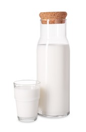 Photo of Carafe and glass of fresh milk isolated on white