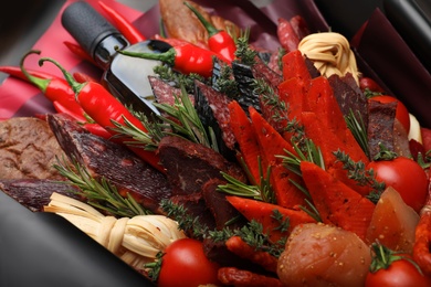 Photo of Beautiful edible bouquet with meat, cheese and vegetables, closeup