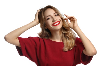 Happy young woman on white background. Christmas celebration