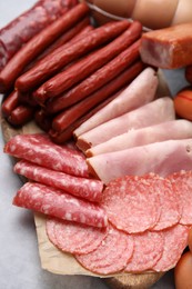 Photo of Different types of sausages on table, closeup