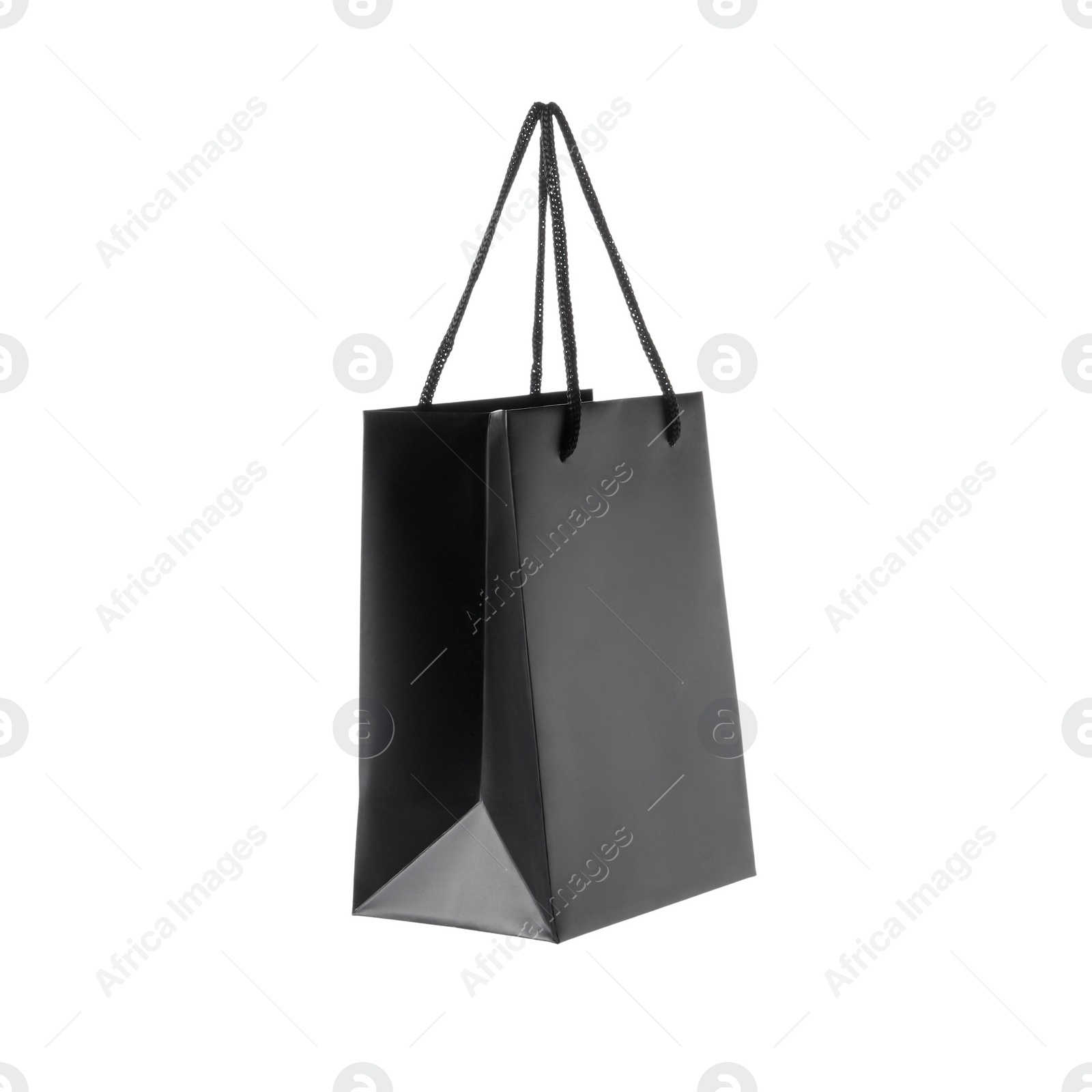 Photo of One black paper bag isolated on white